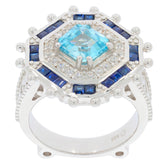 Emerald blue topaz sterling silver ring with accent stones, showcasing a stunning gemstone in a luxurious design.